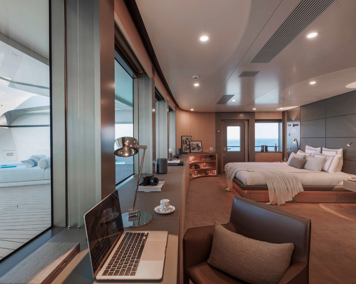 Private suite with desk and sea-facing windows